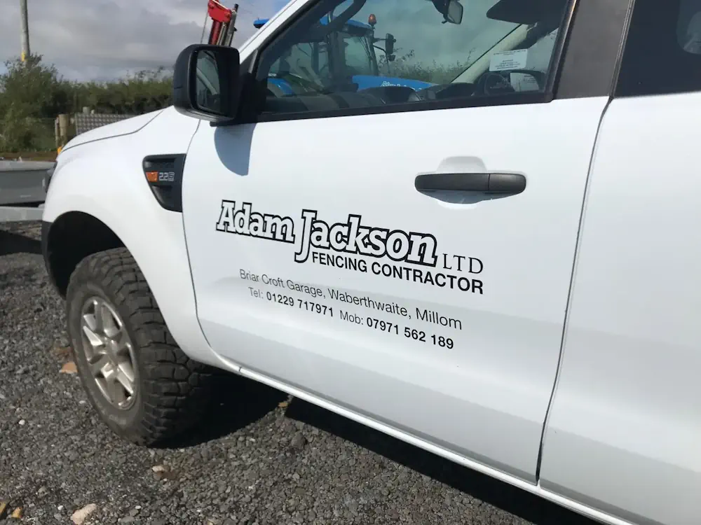 Van with Adam Jackson Fencing Contractor written on it